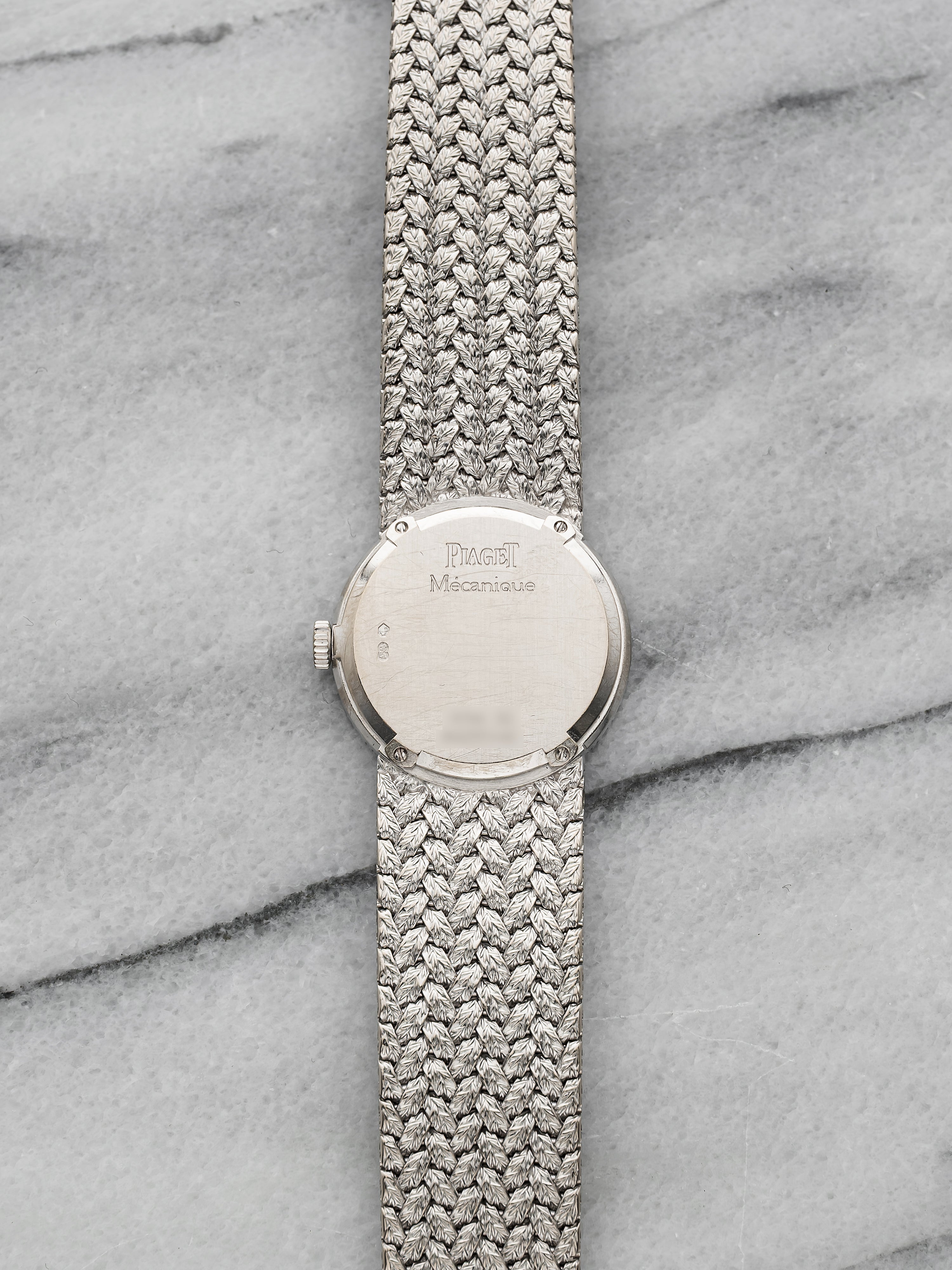 Piaget 9706 - Integrated White Gold Pave Emerald Dial