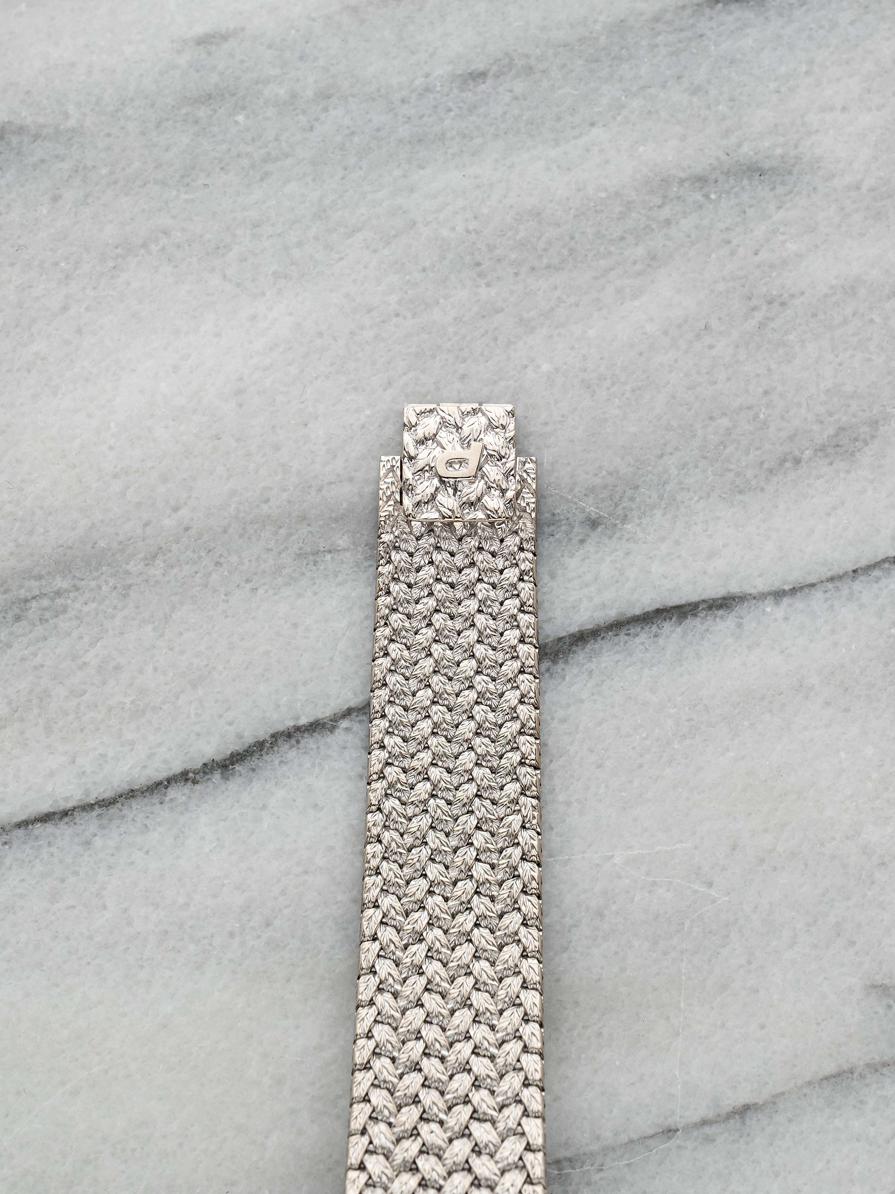 Piaget 9706 - Integrated White Gold Pave Emerald Dial