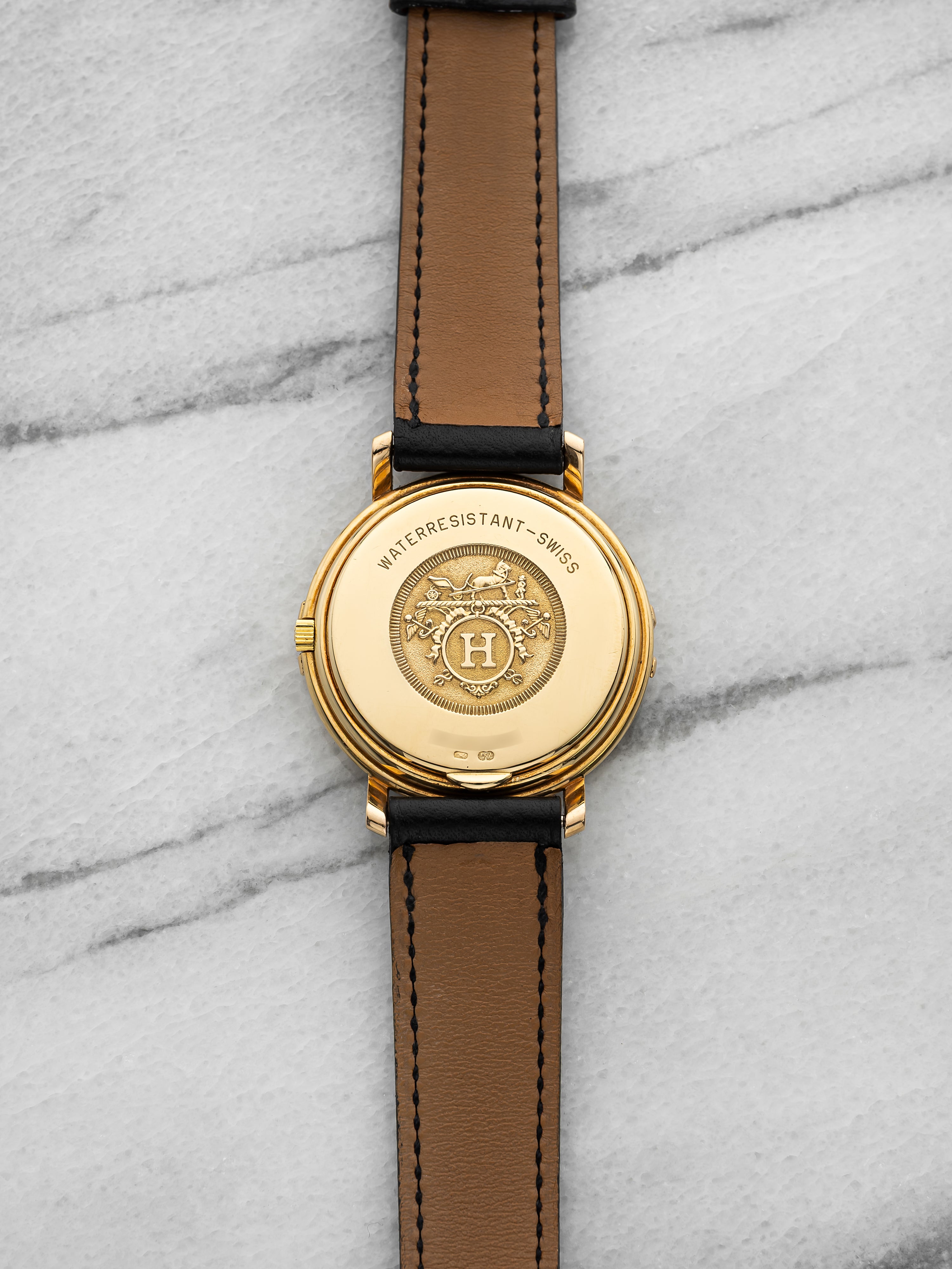 2000s Hermes Ribbon 18K Yellow Gold White Roman Dial Quartz 33 mm