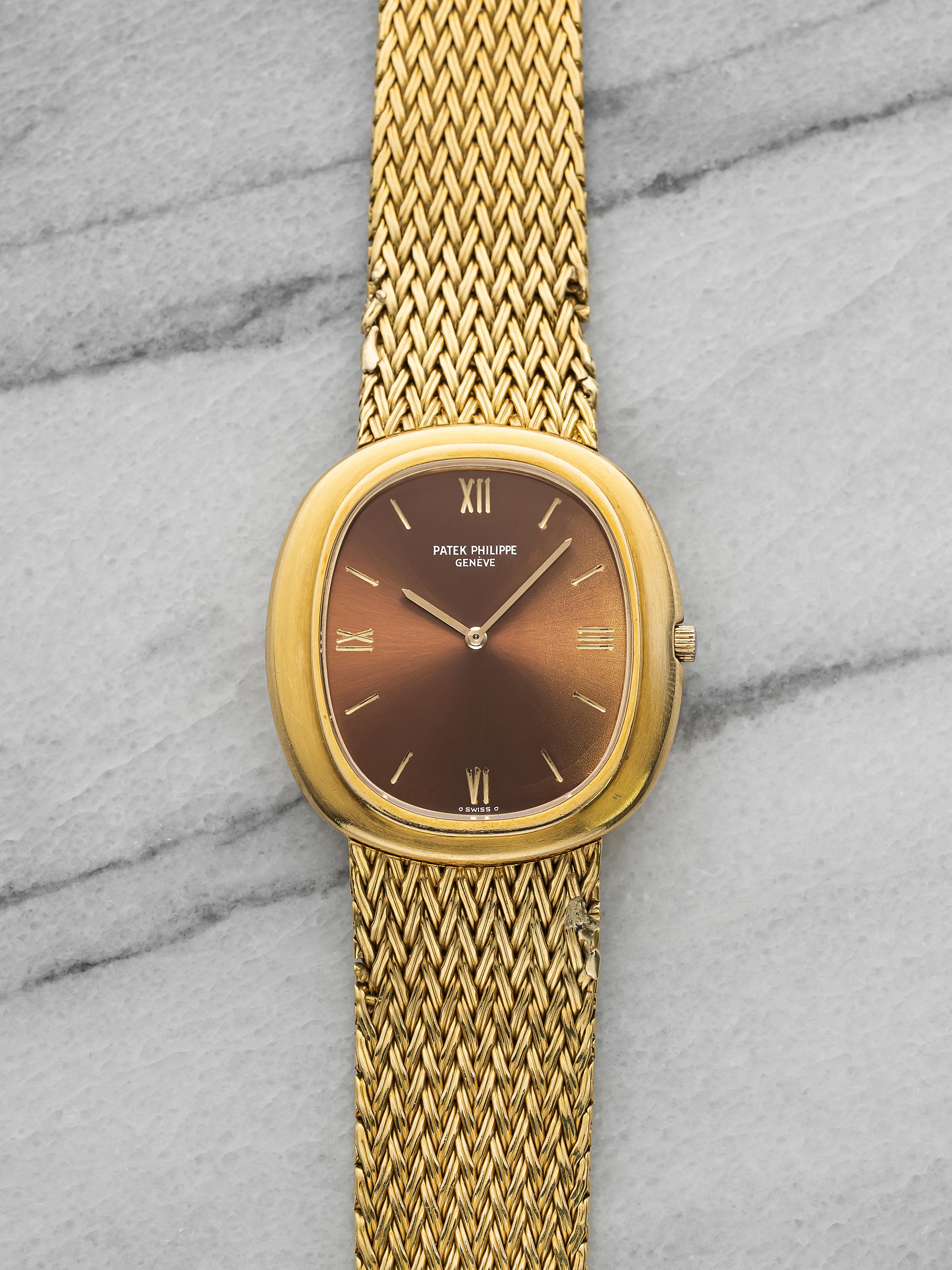 Vintage 1970s Patek Philippe Ellipse 3589/1 18K YG Red Sunburst Dial Auto 33mm