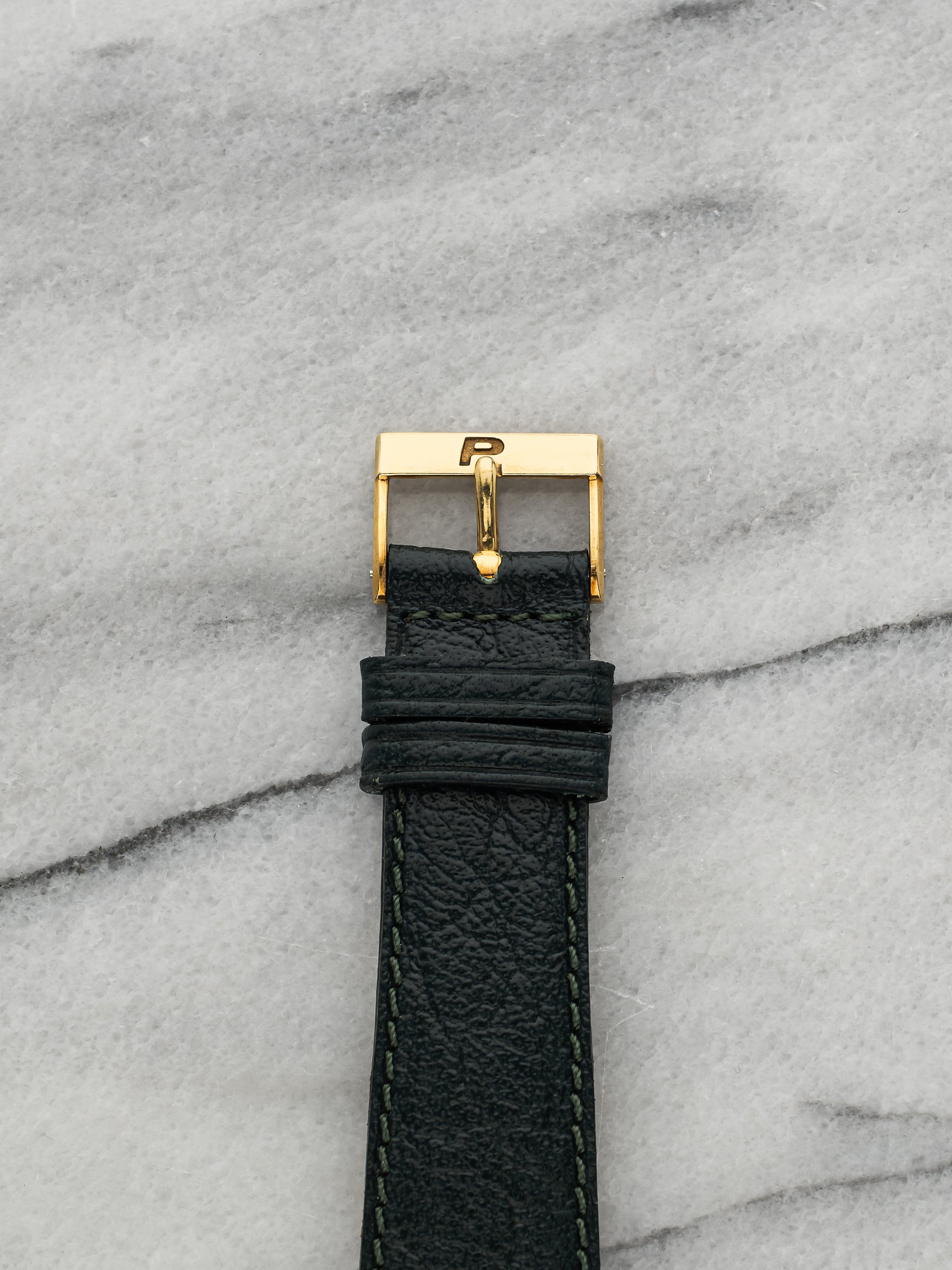 Piaget Polo 7702 – 18k Yellow Gold, Champagne Sunburst Dial