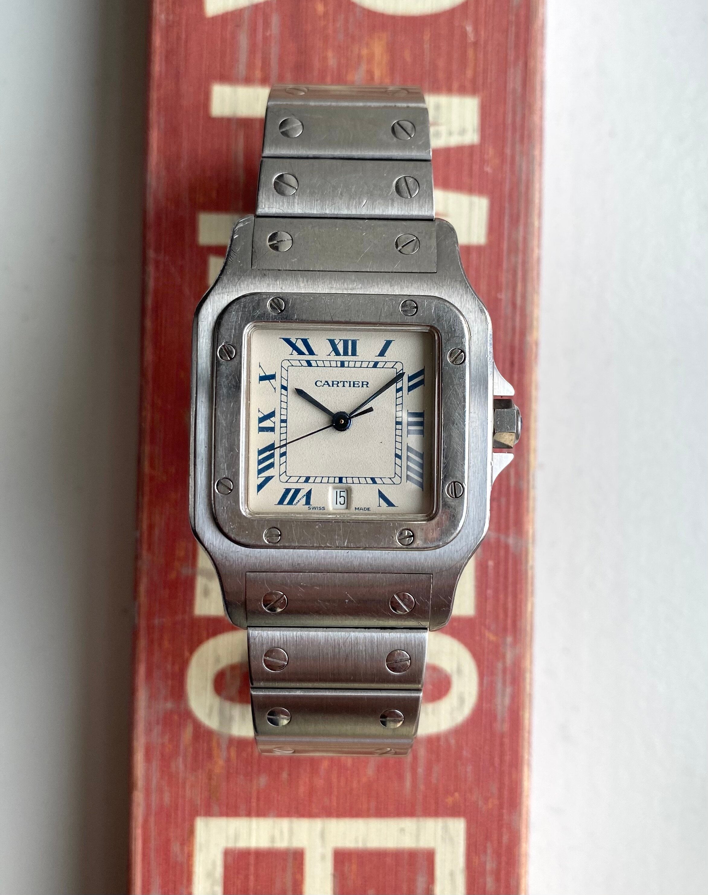 Cartier Santos — Blue Roman Numerals