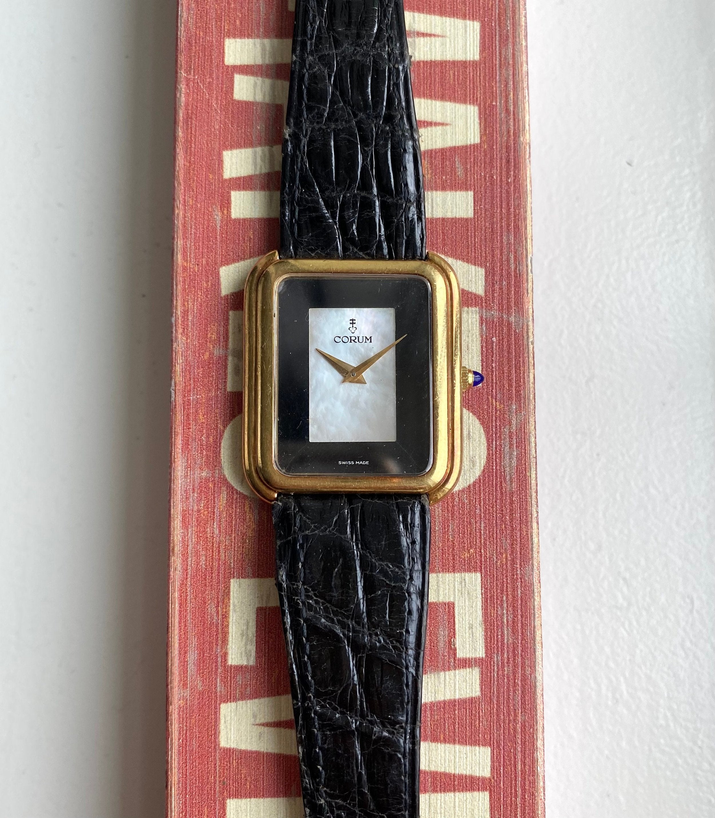 Vintage Corum 70s 18K Yellow Gold Tank Manual Wind Black Mother of Pearl Dial Stepped Case