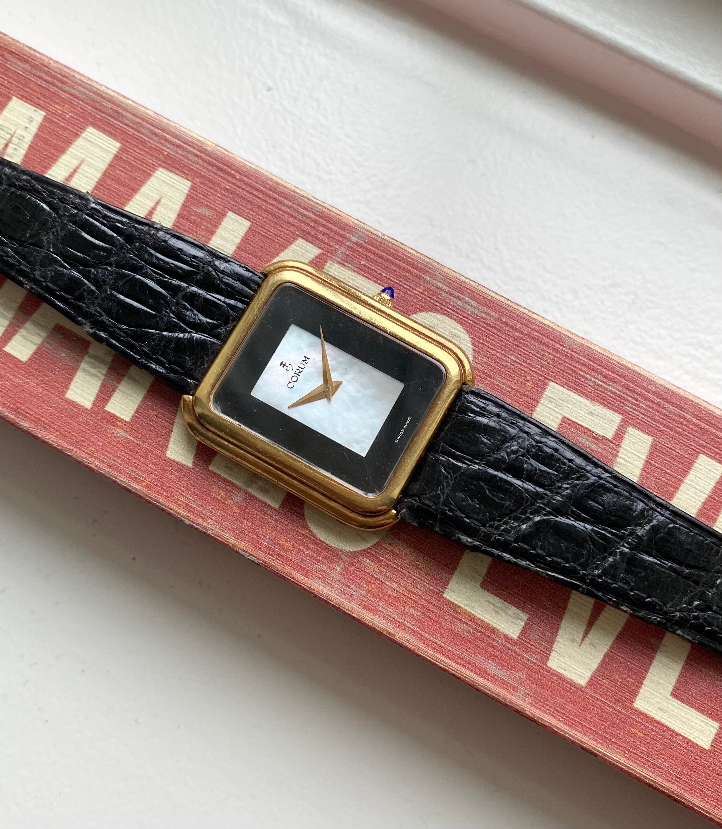 Vintage Corum 70s 18K Yellow Gold Tank Manual Wind Black Mother of Pearl Dial Stepped Case
