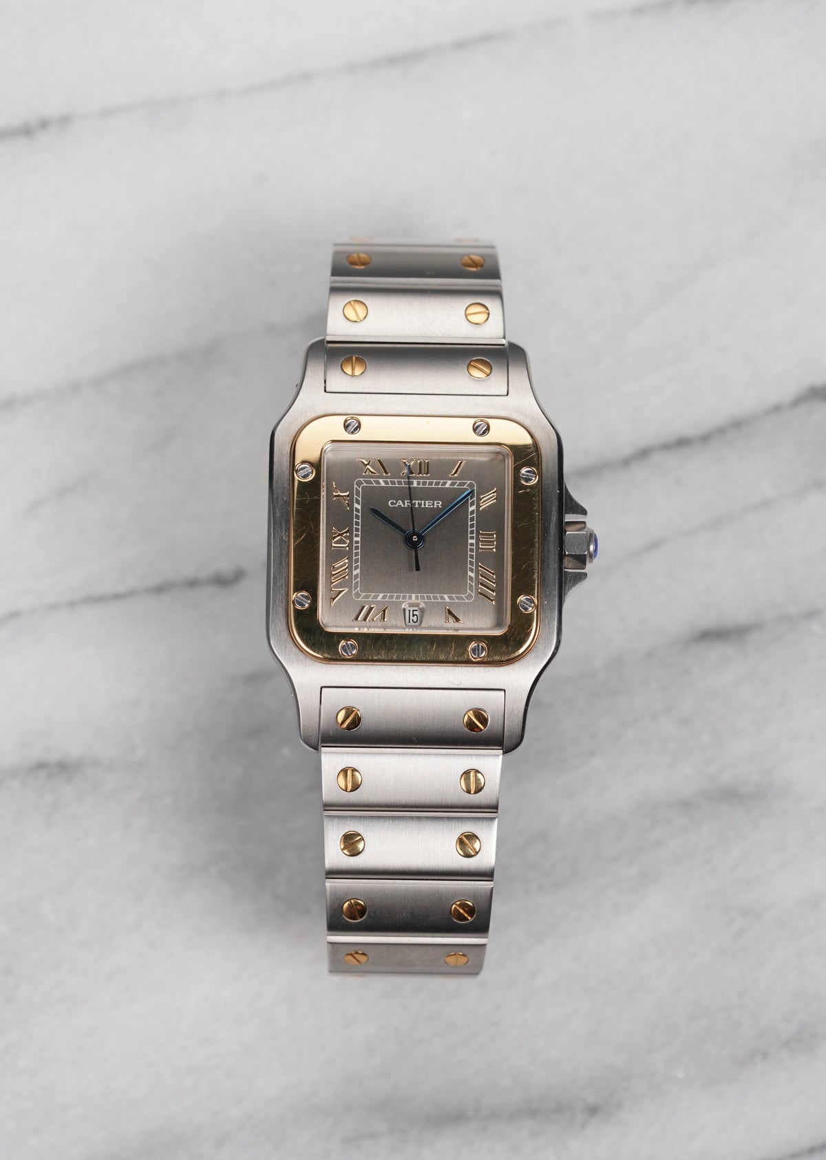 Two-tone Santos 1566 with the brownish 'mocha' dial and Roman numerals. · Photo: Danny's Vintage Watches · © Danny's Vintage Watches, used with permission · Source: https://dannysvintagewatches.com/products/cartier-santos-1566-two-tone-mocha