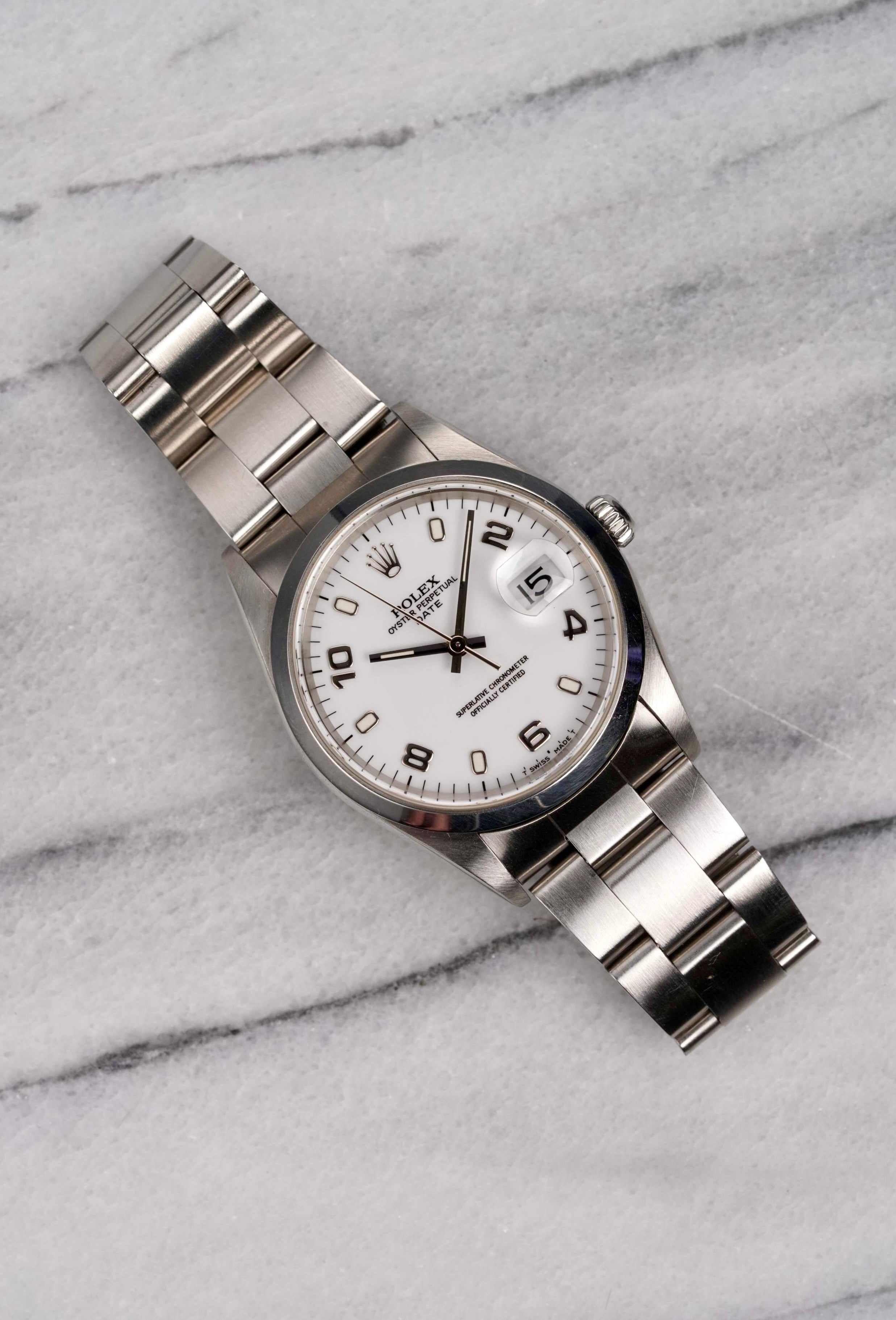 Rolex OP 15200 - White Arabic Dial.