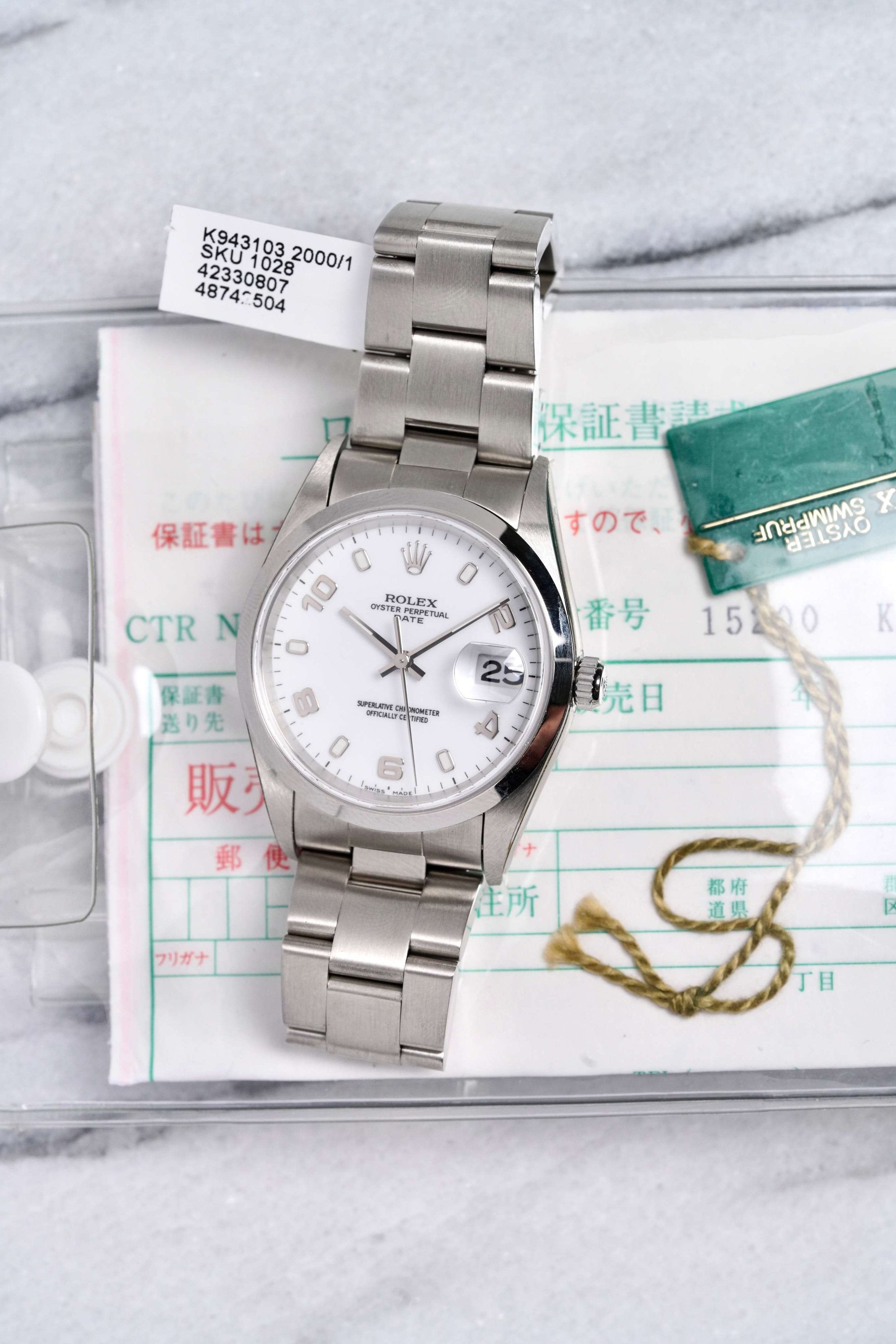 Rolex OP 15200 - White Dial w/ Papers.