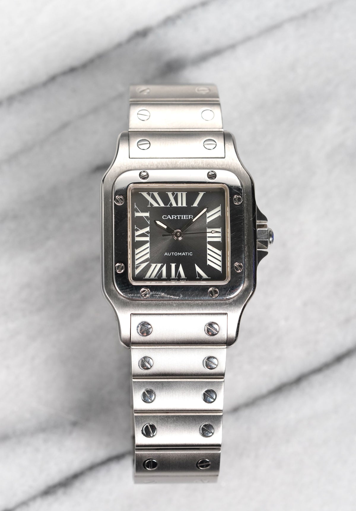Steel Santos 2319 with the slate-grey sunray dial, white Roman numerals and date, the SIHH limited edition. · Photo: Danny's Vintage Watches · © Danny's Vintage Watches, used with permission · Source: https://dannysvintagewatches.com/products/cartier-santos-2319-grey-dial-limited-edition