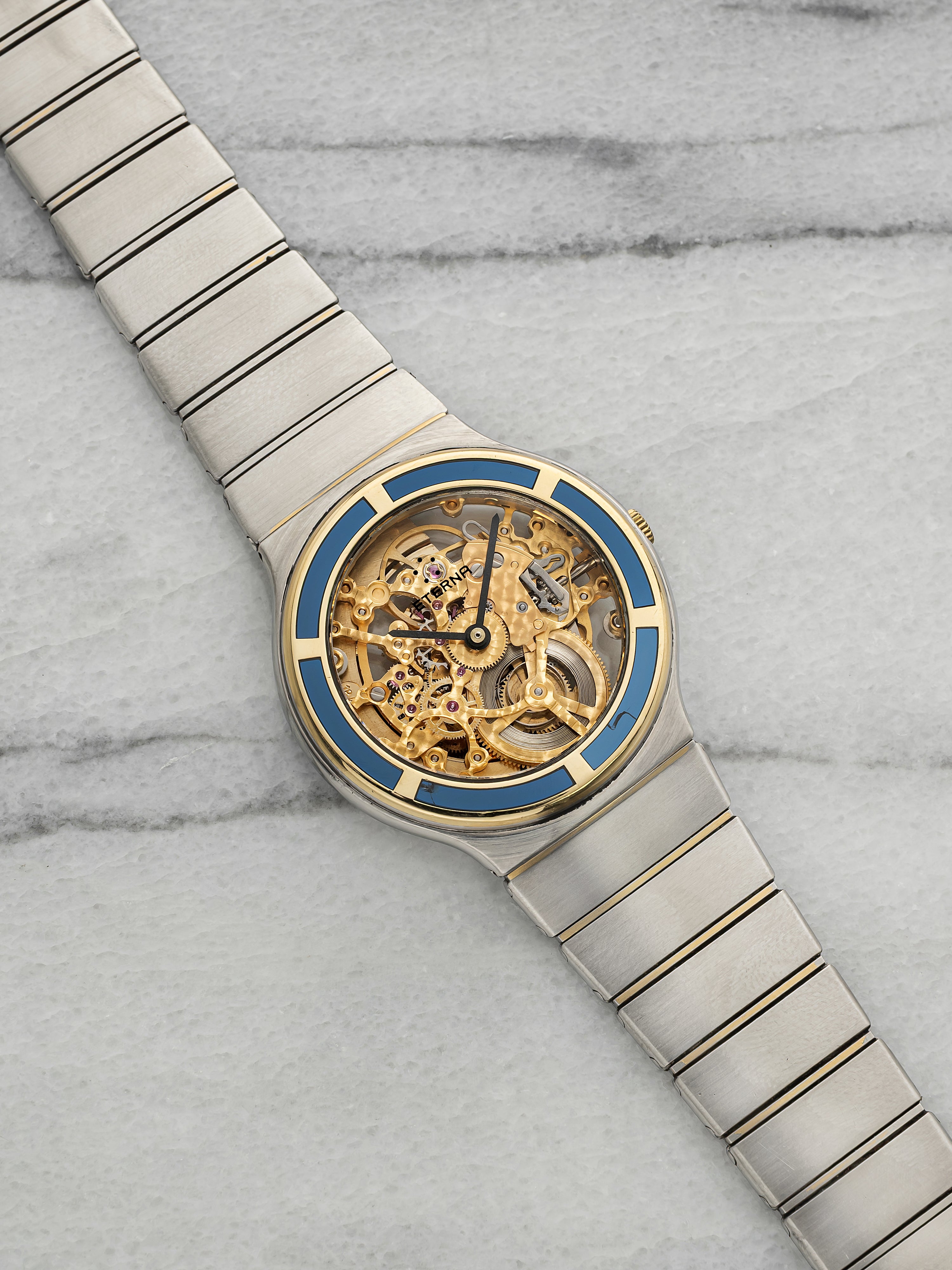 Vintage 1990s Eterna Gold Club Two Tone Sapphire Bezel Skeleton Dial Auto 34mm