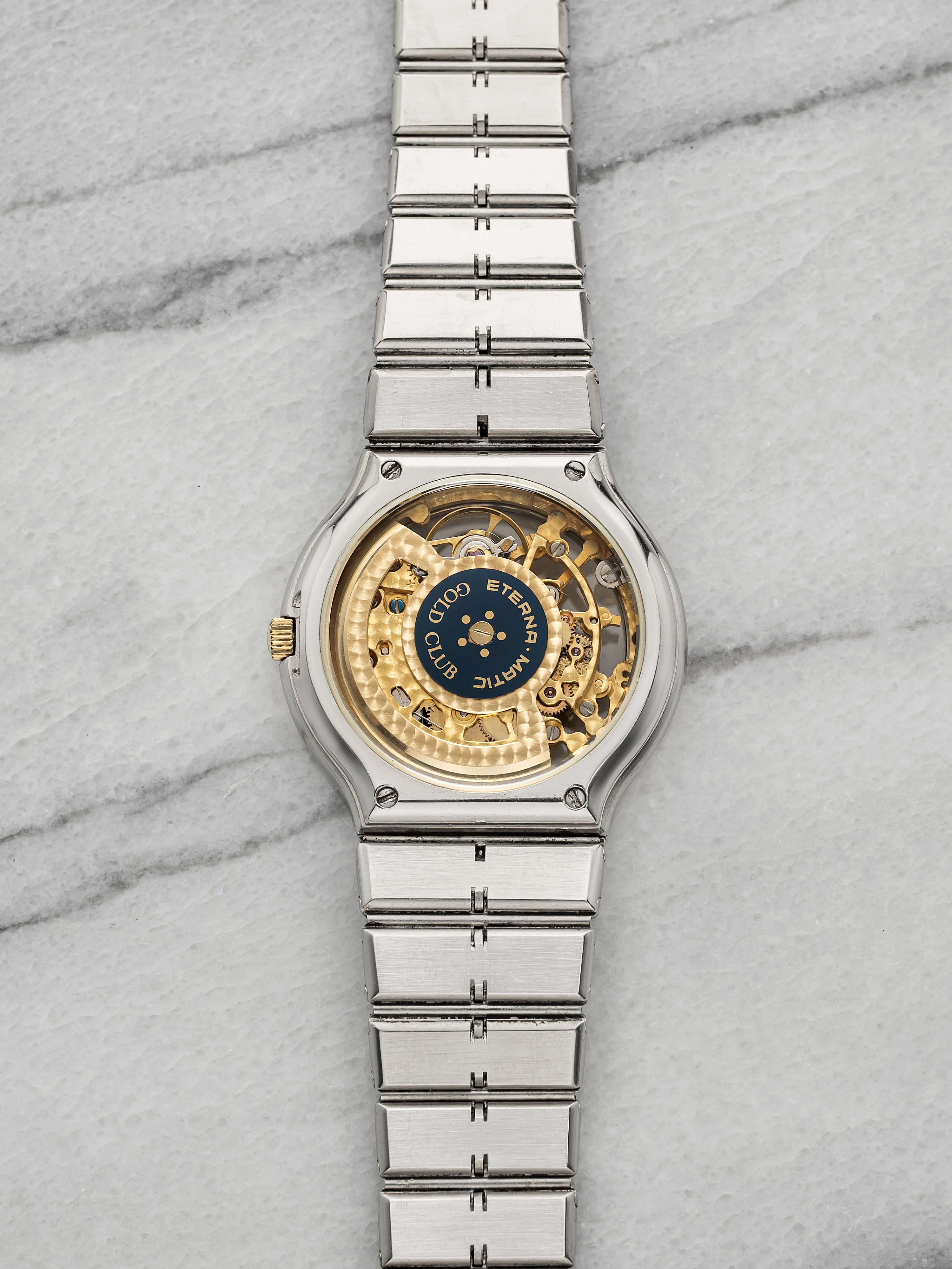 Vintage 1990s Eterna Gold Club Two Tone Sapphire Bezel Skeleton Dial Auto 34mm