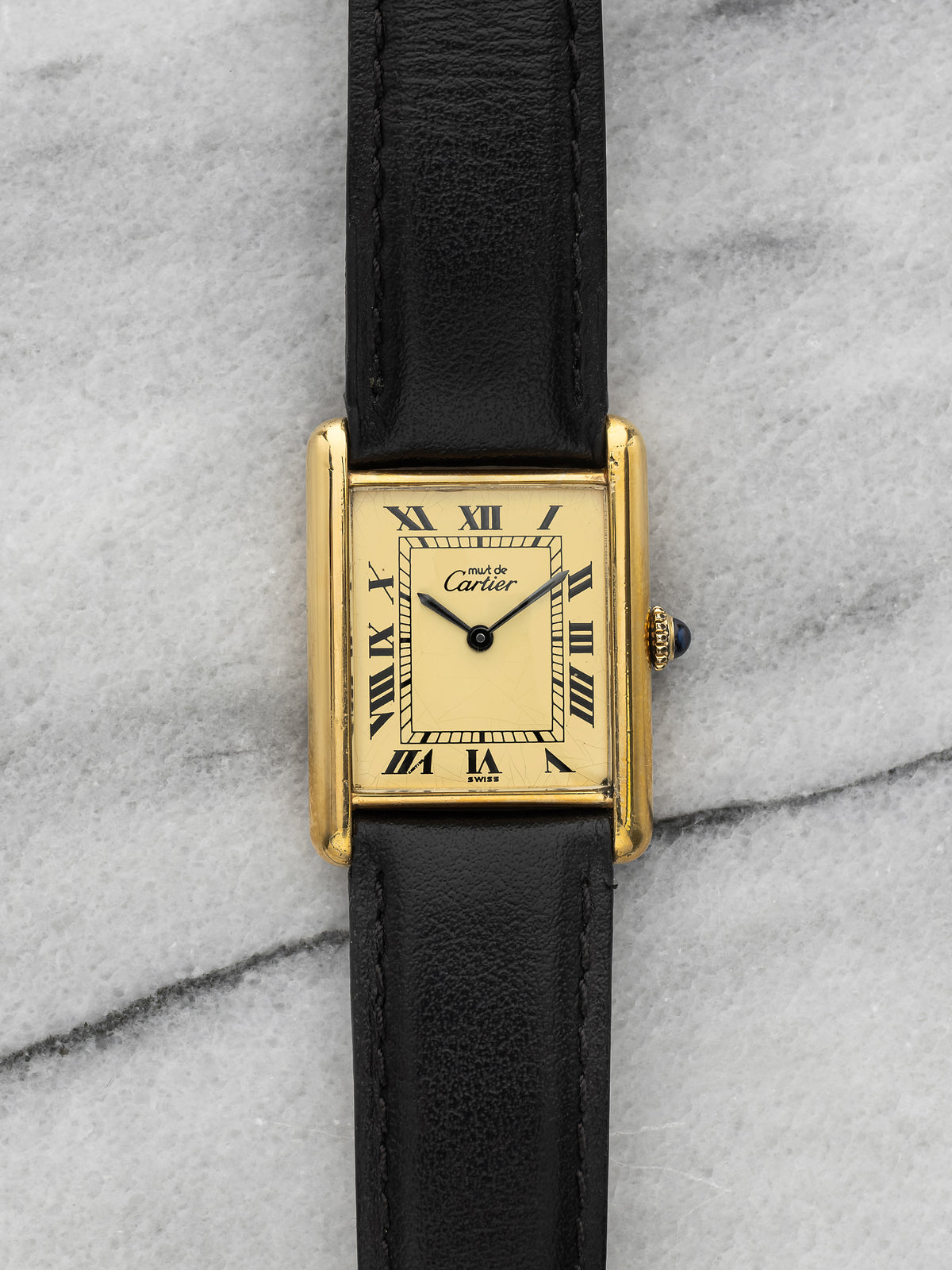Large vermeil Must de Cartier Tank with a bright lemon-yellow dial printed with black Roman numerals and railway minute track, blued hands, the lemon Roman LM variant. · Photo: Danny’s Vintage Watches · © Danny’s Vintage Watches, used with permission · Source: https://dannysvintagewatches.com/products/cartier-tank-must-vermeil-lemon-roman-dial