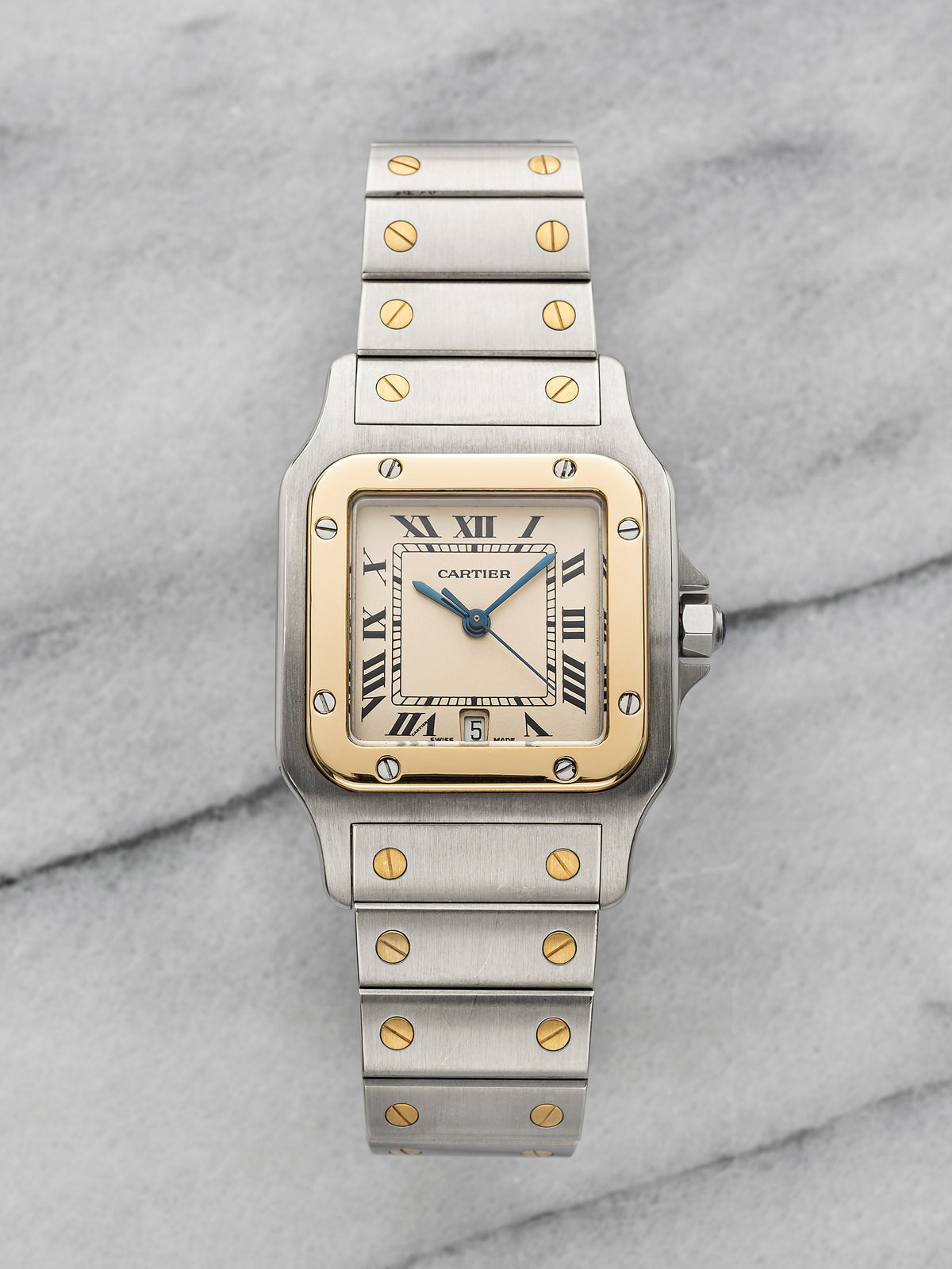 Two-tone Santos Galbée 187901 with a warm ivory-cream dial, black Roman numerals, blued hands and date. · Photo: Danny's Vintage Watches · © Danny's Vintage Watches, used with permission · Source: https://dannysvintagewatches.com/products/cartier-santos-galbee-187901-two-tone-cream-roman-dial