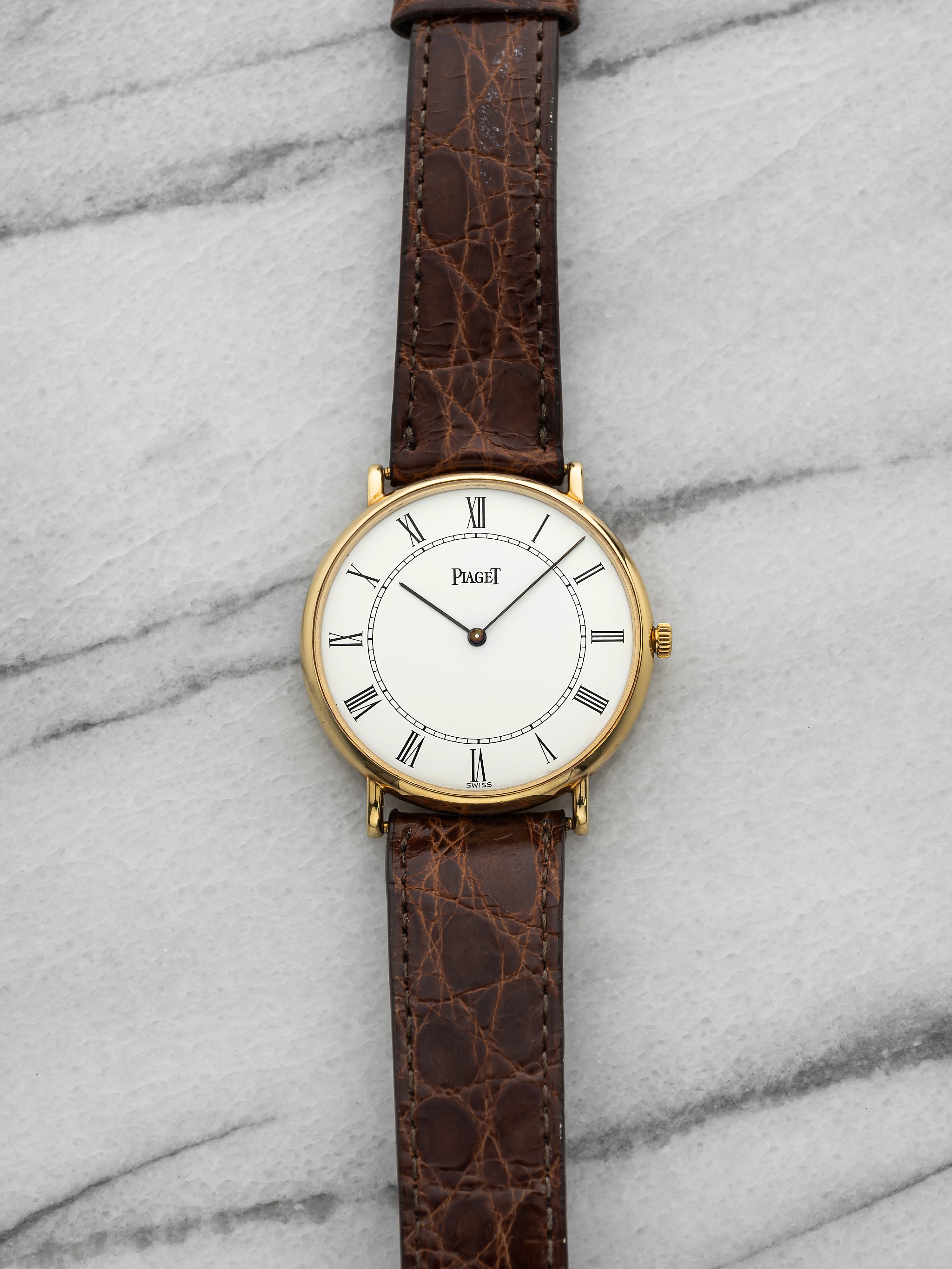 Vintage 1980s Piaget  8035 N Dress Watch 18K YG White Roman Dial Quartz 32 mm