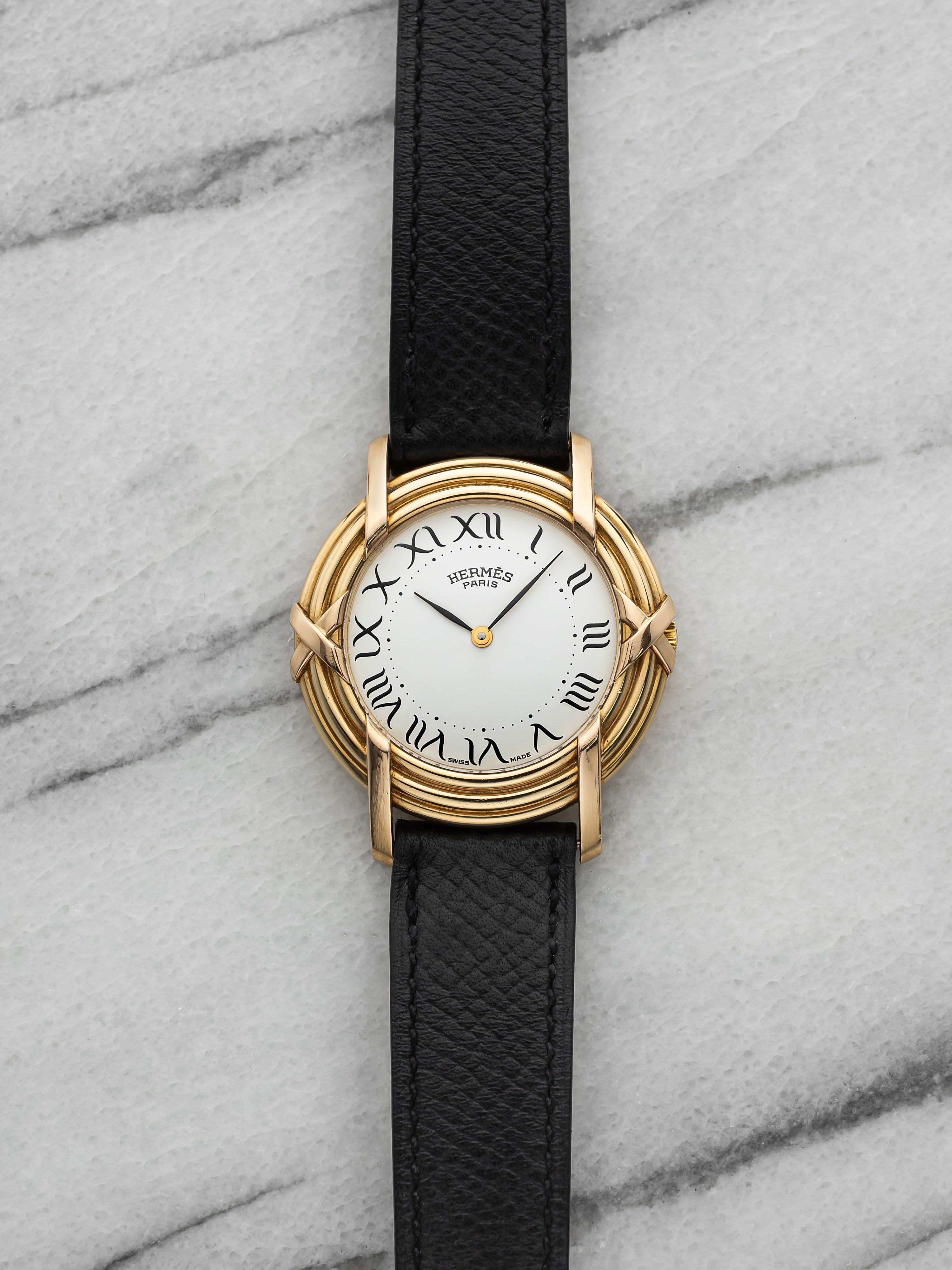 2000s Hermes Ribbon 18K Yellow Gold White Roman Dial Quartz 33 mm