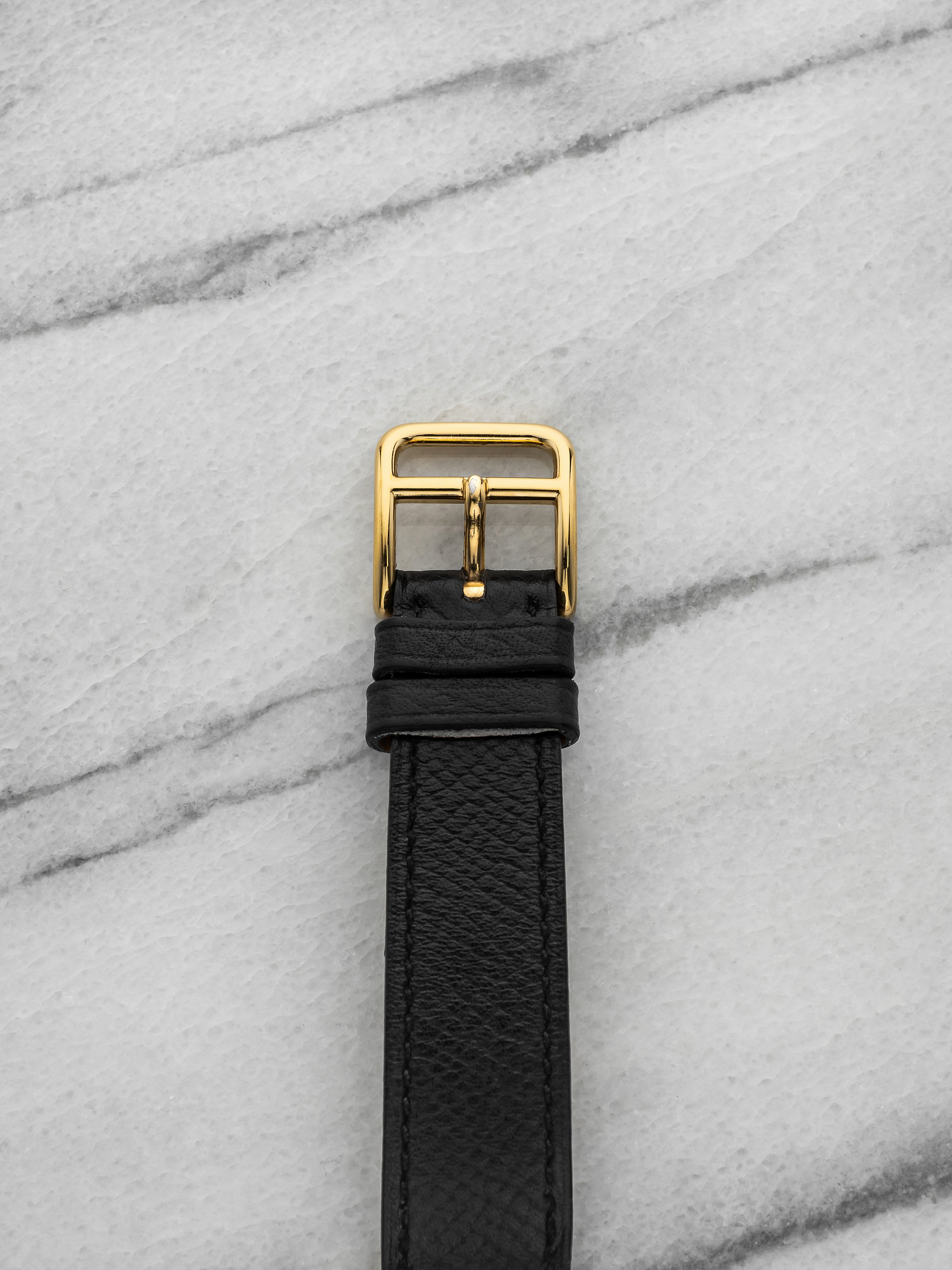 2000s Hermes Ribbon 18K Yellow Gold White Roman Dial Quartz 33 mm