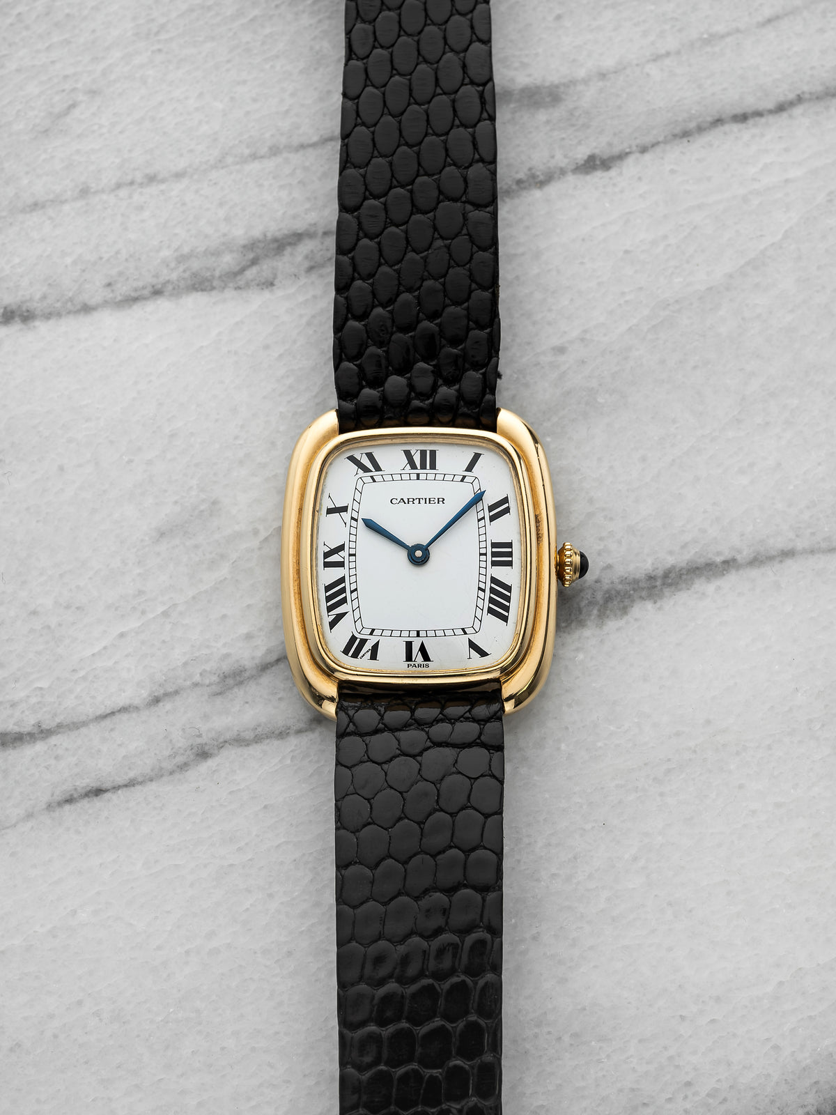 Lady's Gondole ref. 1701 in yellow gold with white Roman 'Paris' dial. · Photo: Danny's Vintage Watches · © Danny's Vintage Watches, used with permission · Source: https://dannysvintagewatches.com/products/cartier-gondole-paris-dial-1701-18k-yellow-gold