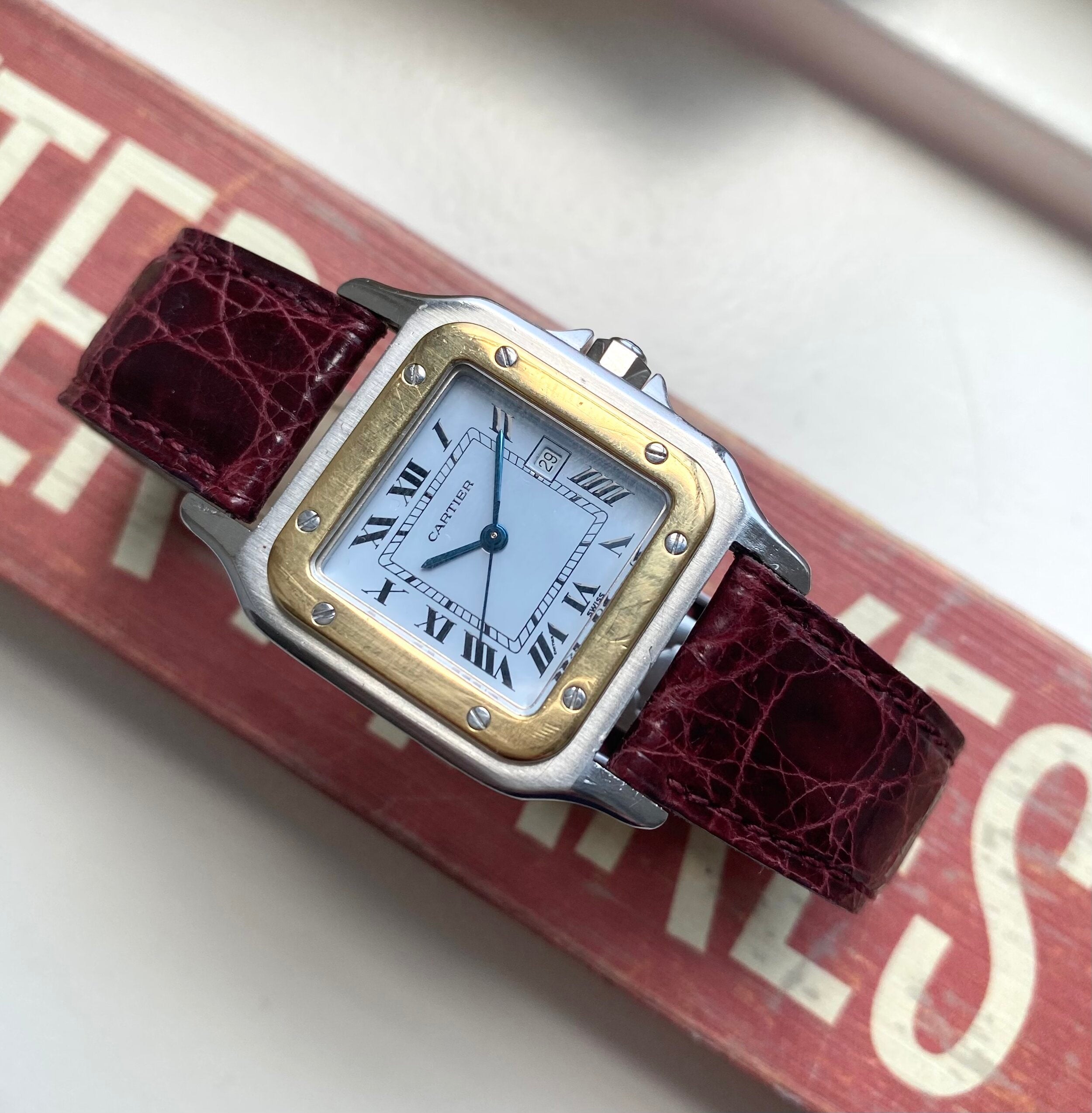 Cartier Santos — Two-tone Black Roman Numeral Dial