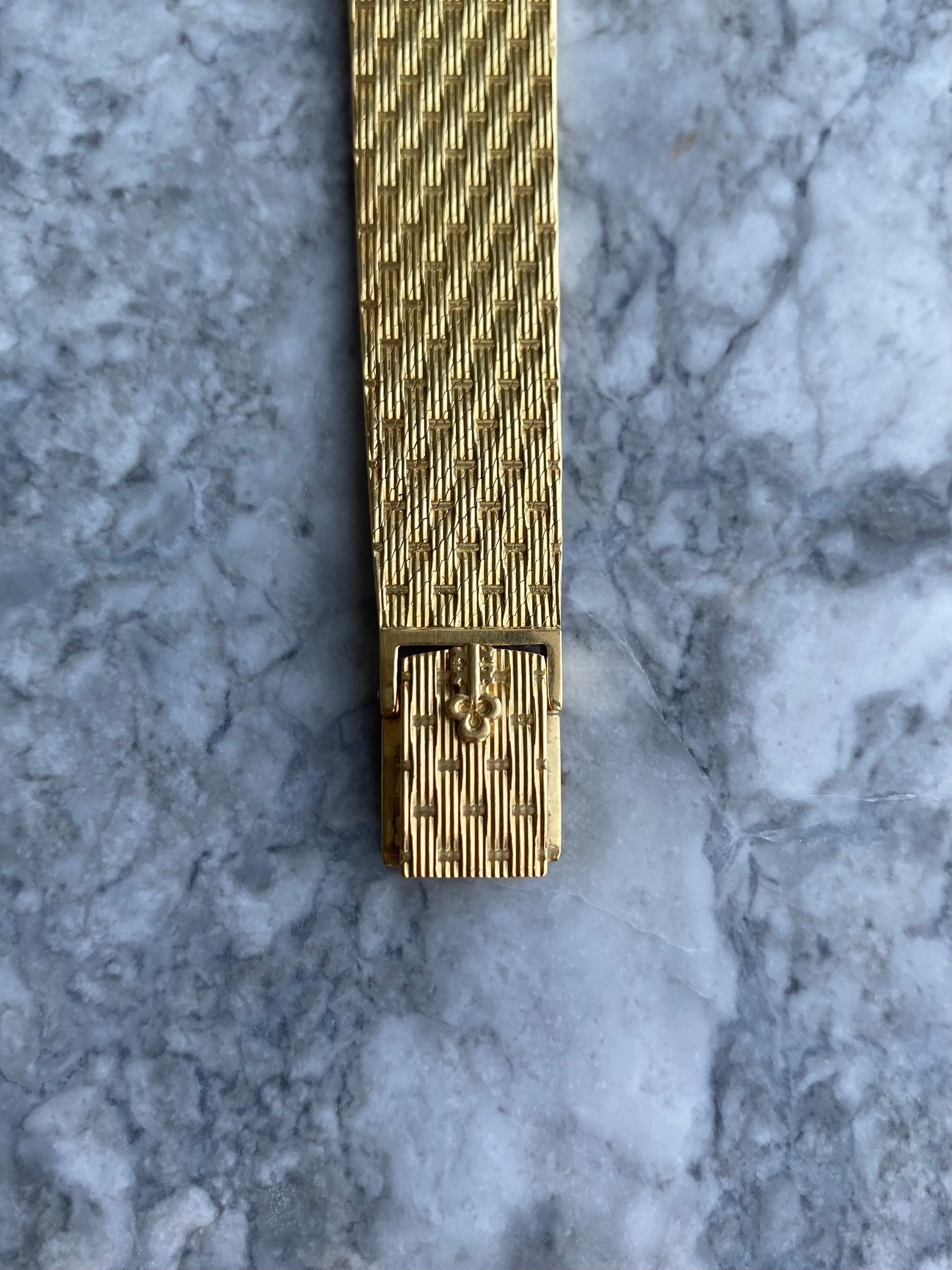 Corum - 18K Yellow Gold.