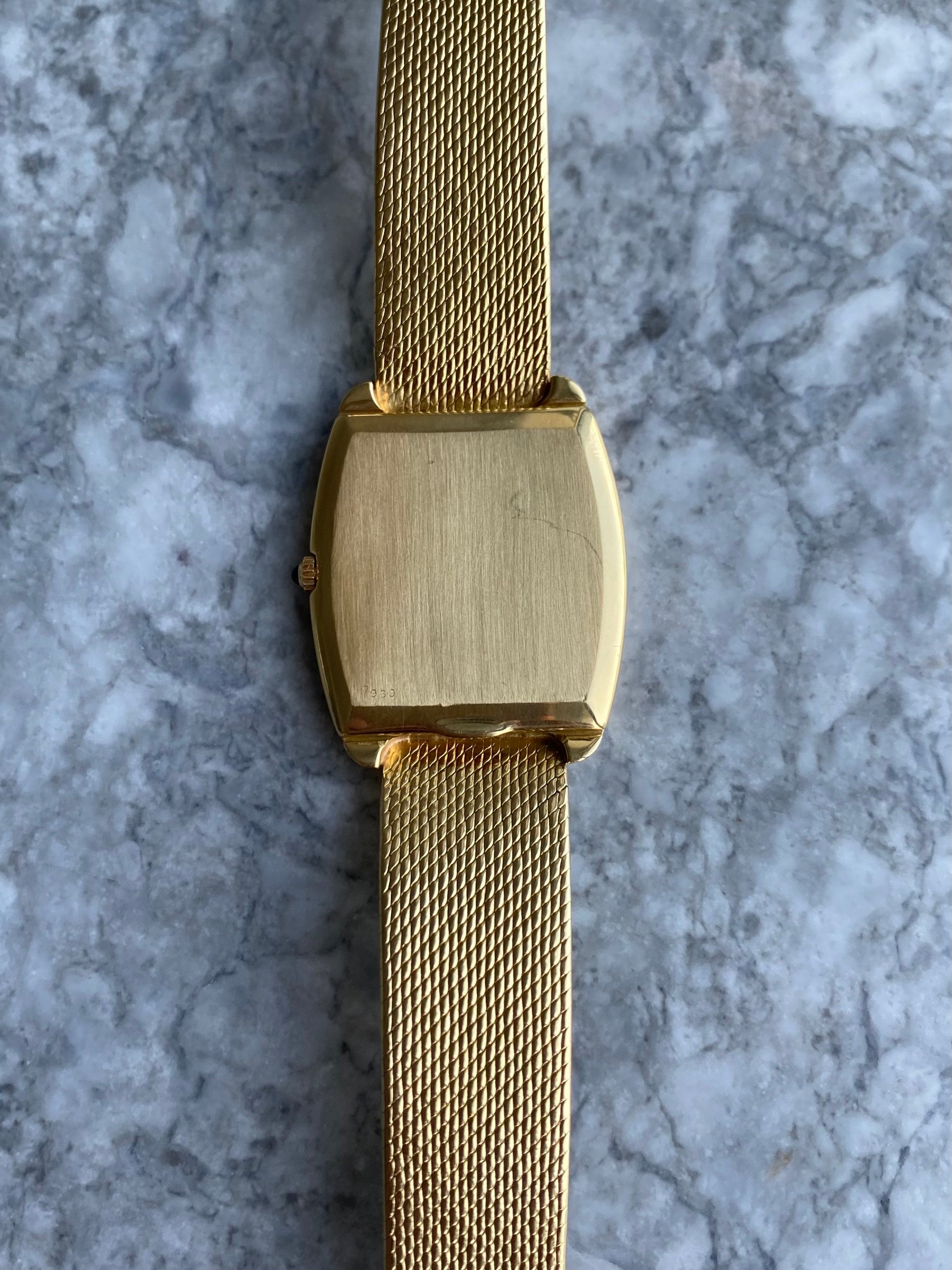 Corum - 18K Yellow Gold.