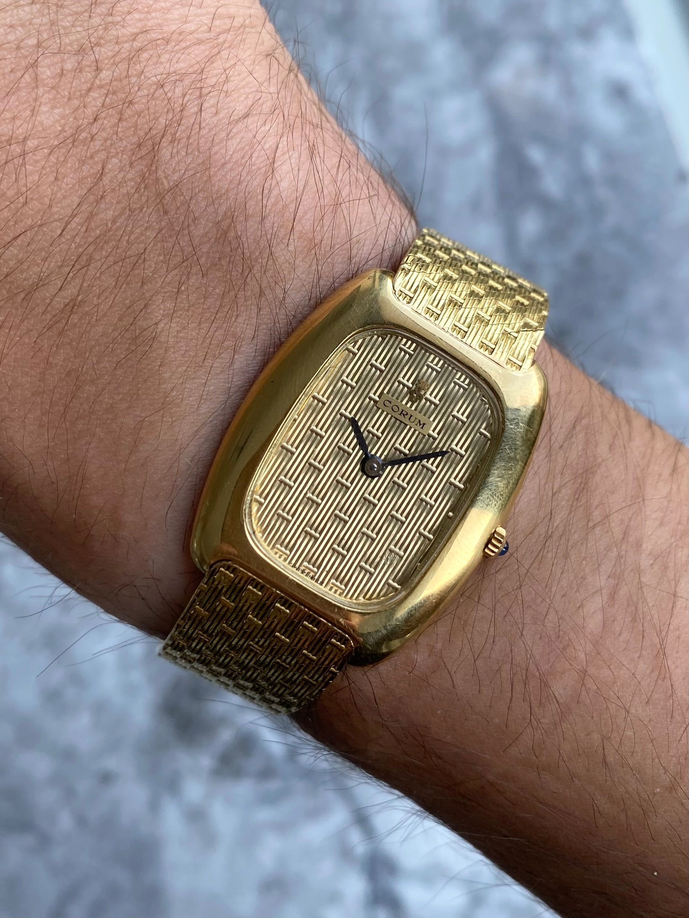 Corum - 18K Yellow Gold.