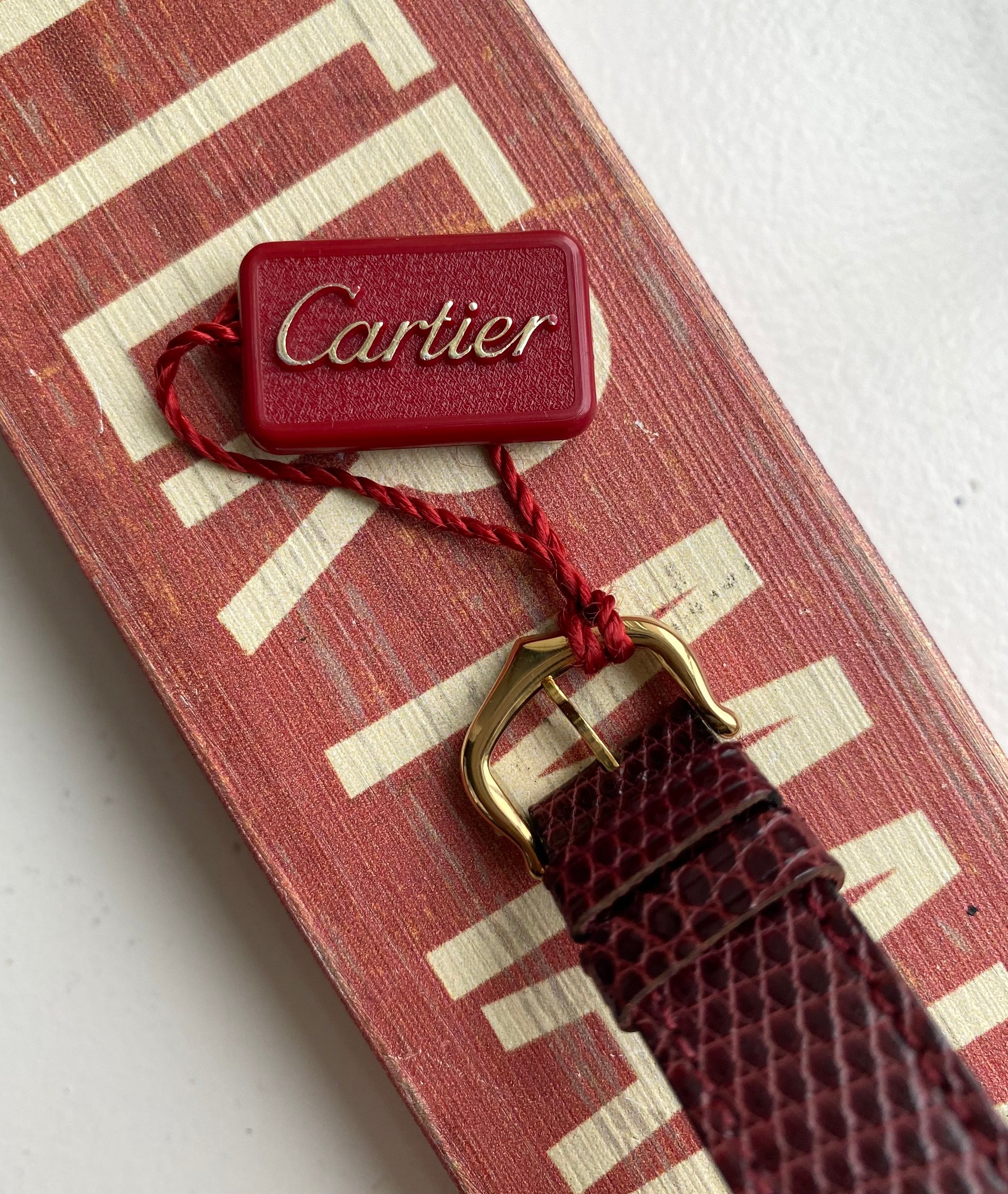 Cartier Tank — Maroon Dial