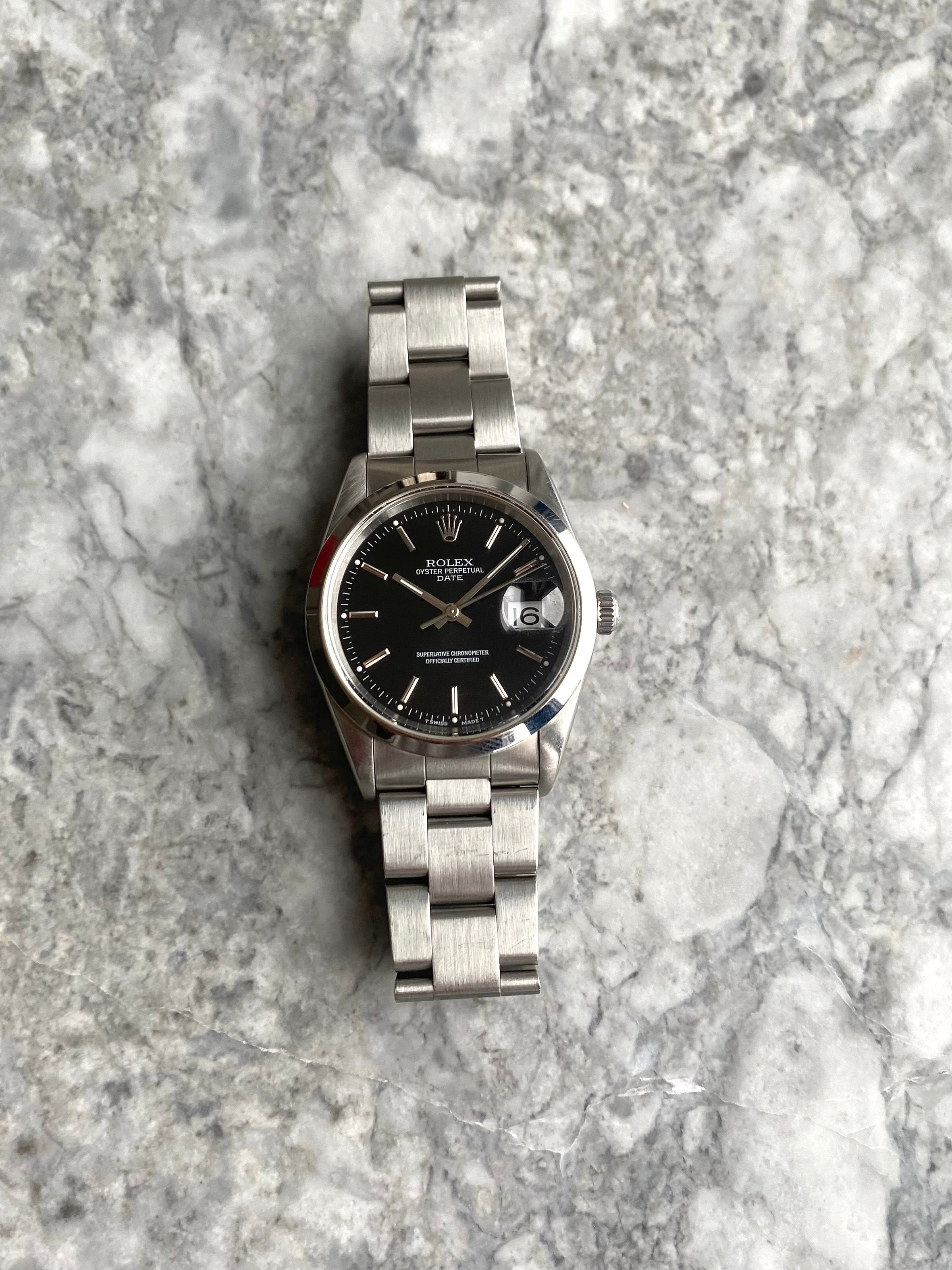 Rolex OP 15200 - Black Dial.