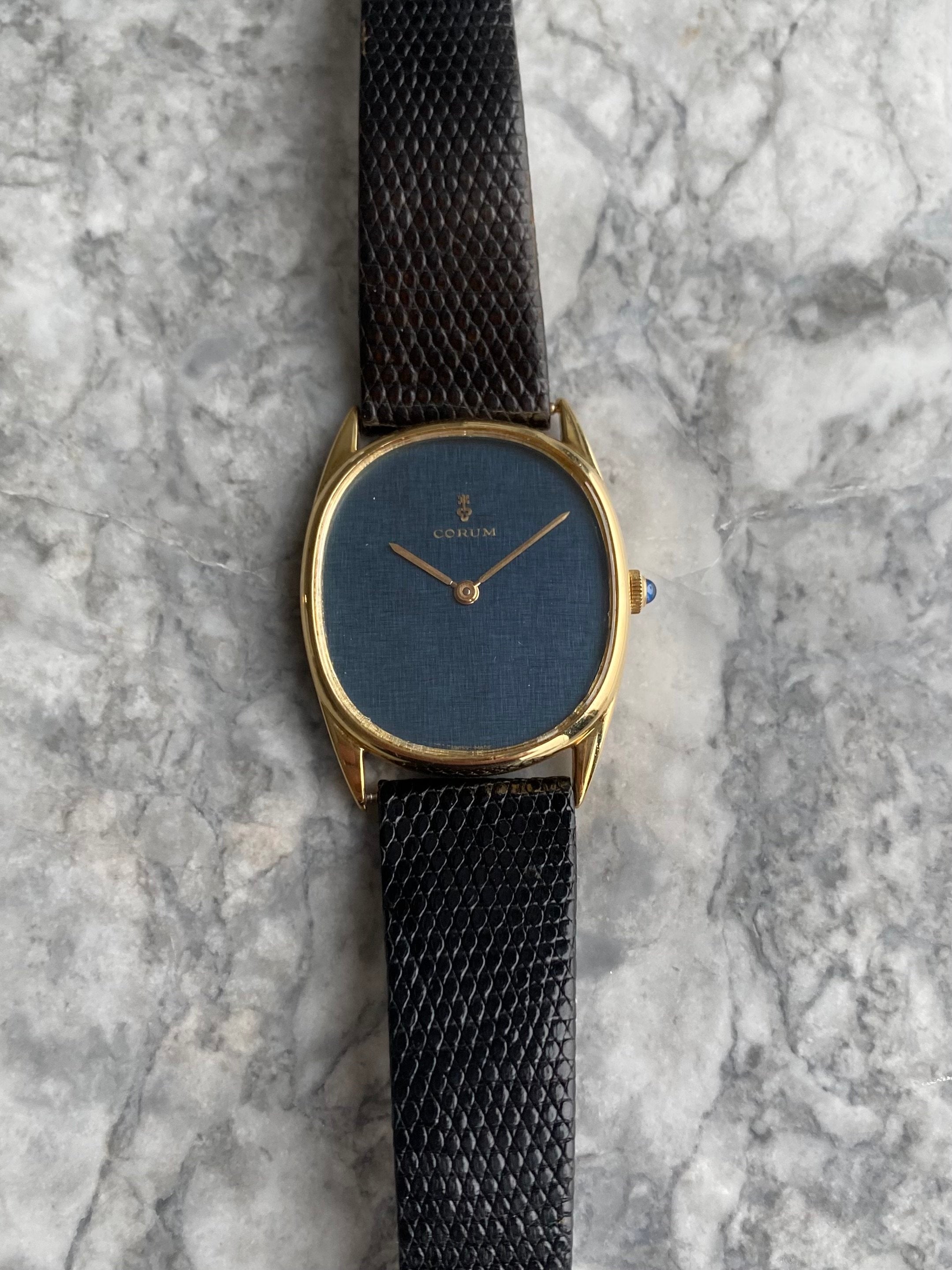 Corum 18K Gold - Blue Linen Dial.