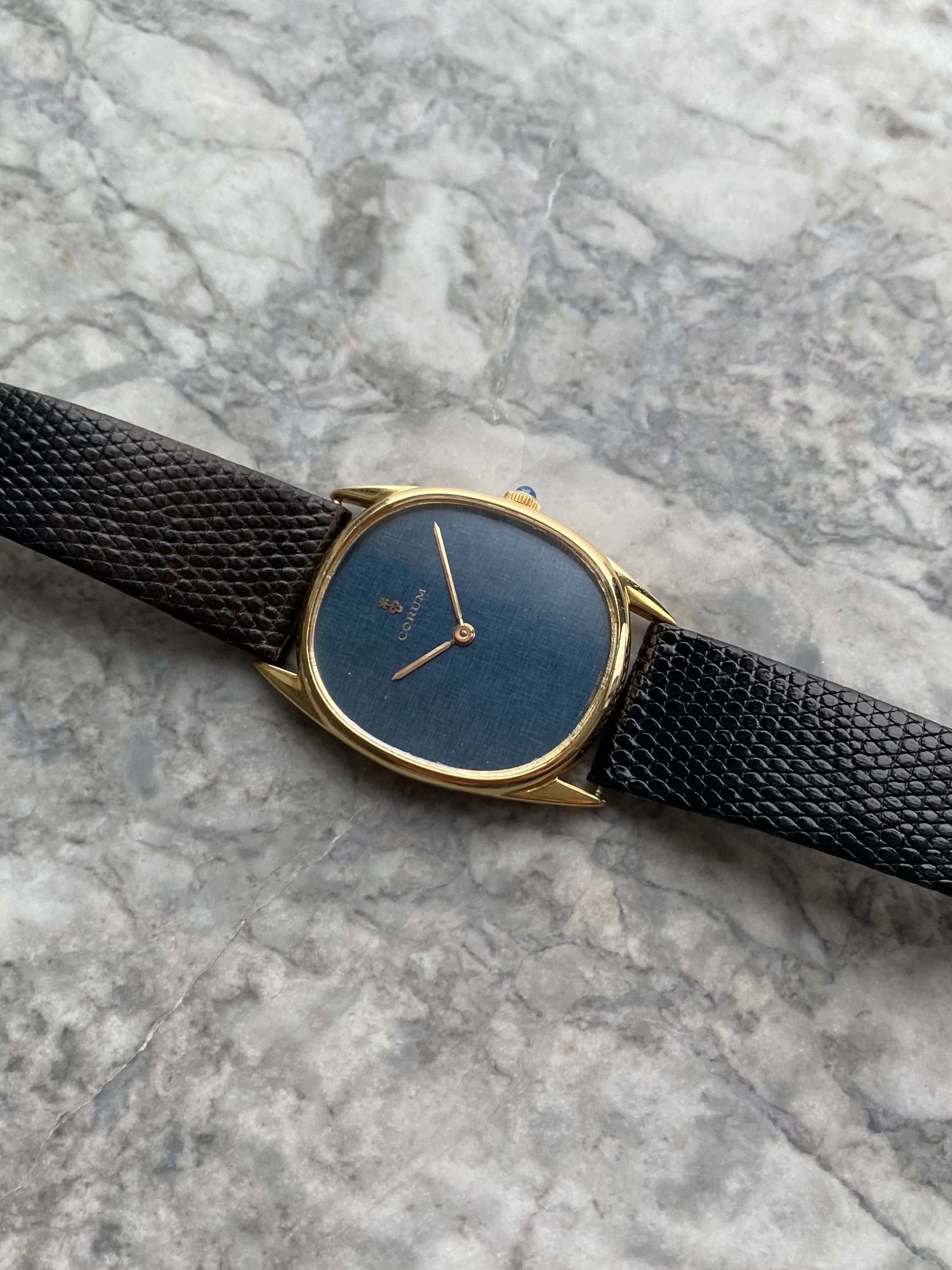 Corum 18K Gold - Blue Linen Dial.