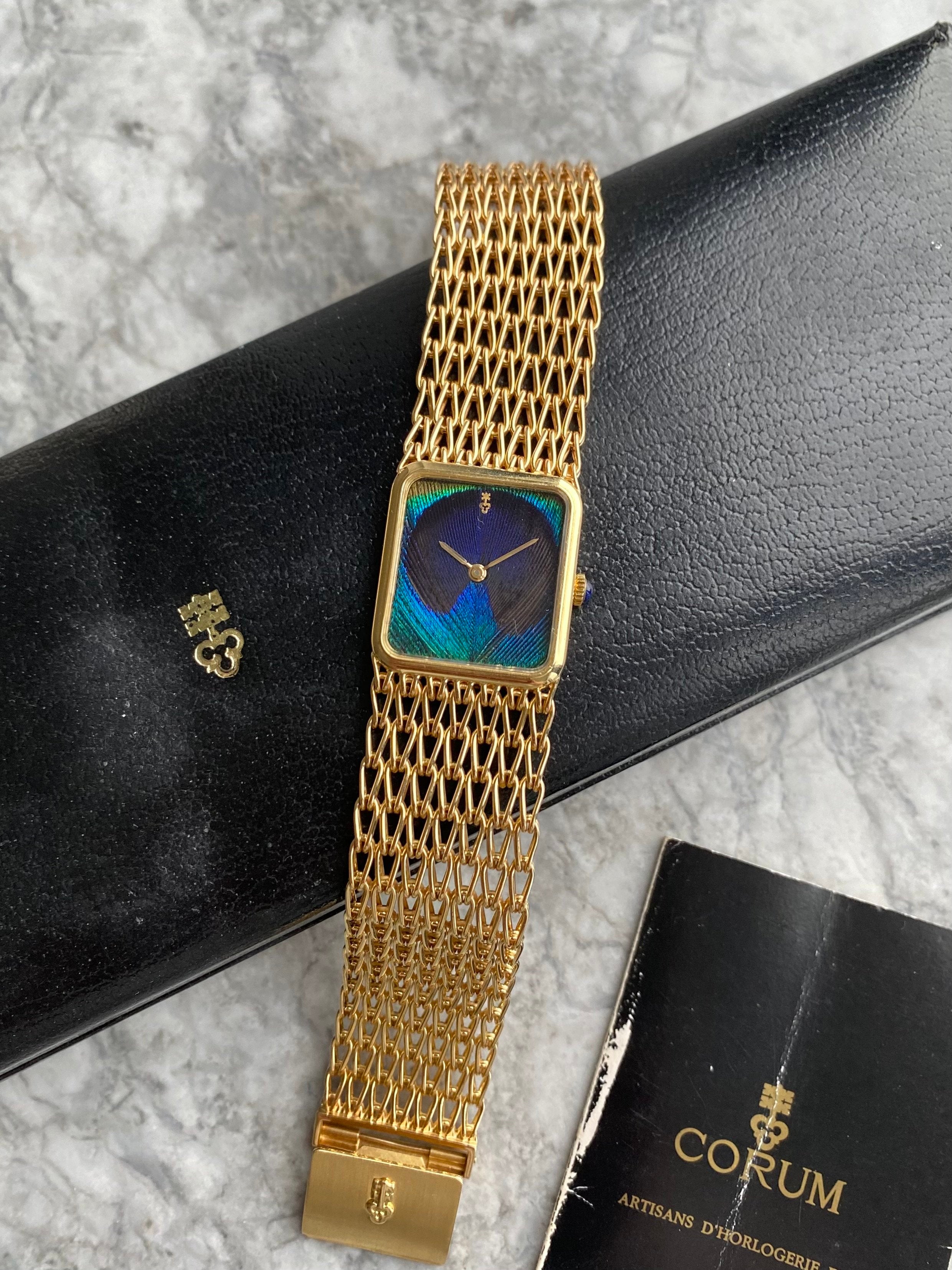 Corum Peacock 18K Gold - Box & Papers