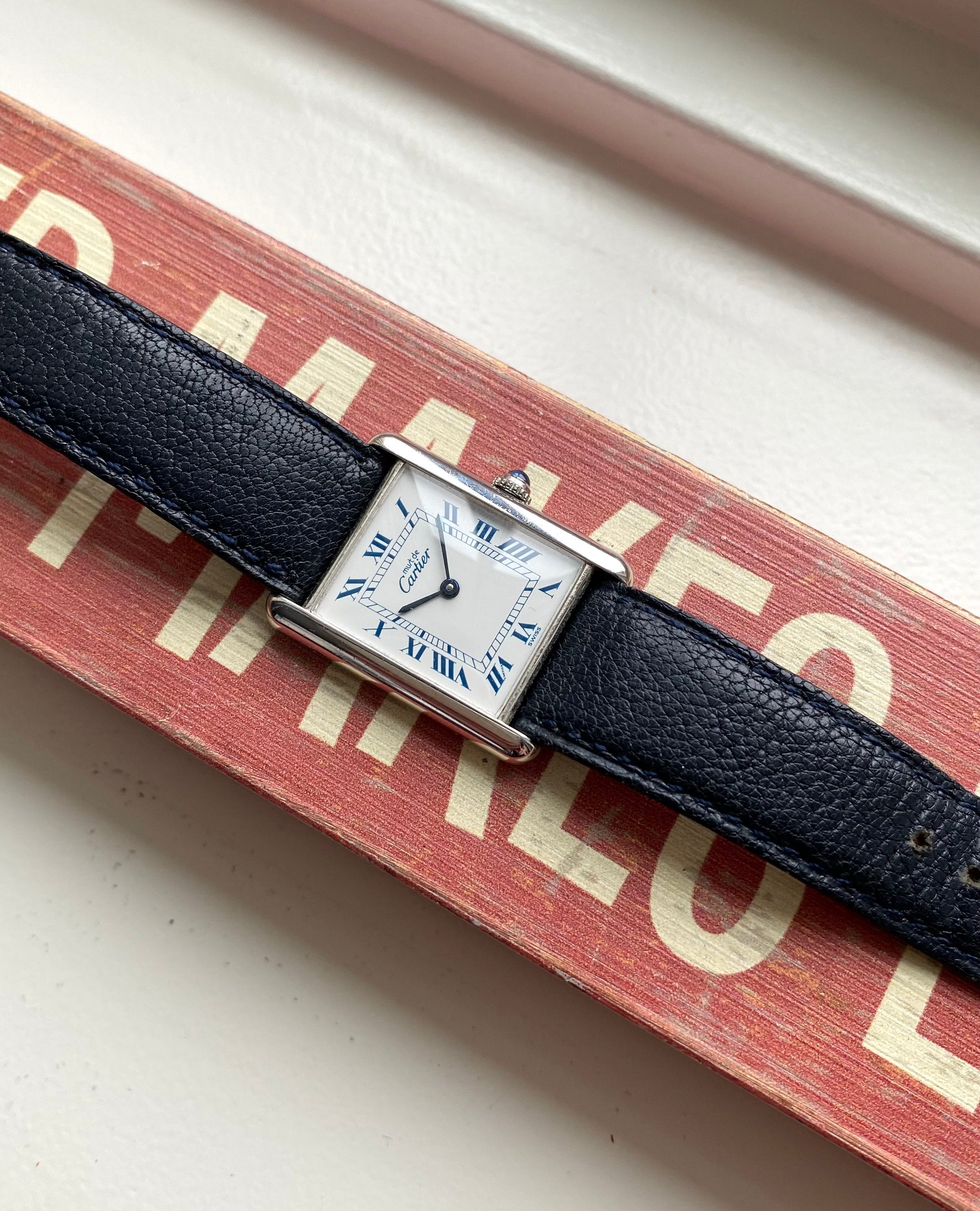 Cartier Tank — White Roman Numeral Dial