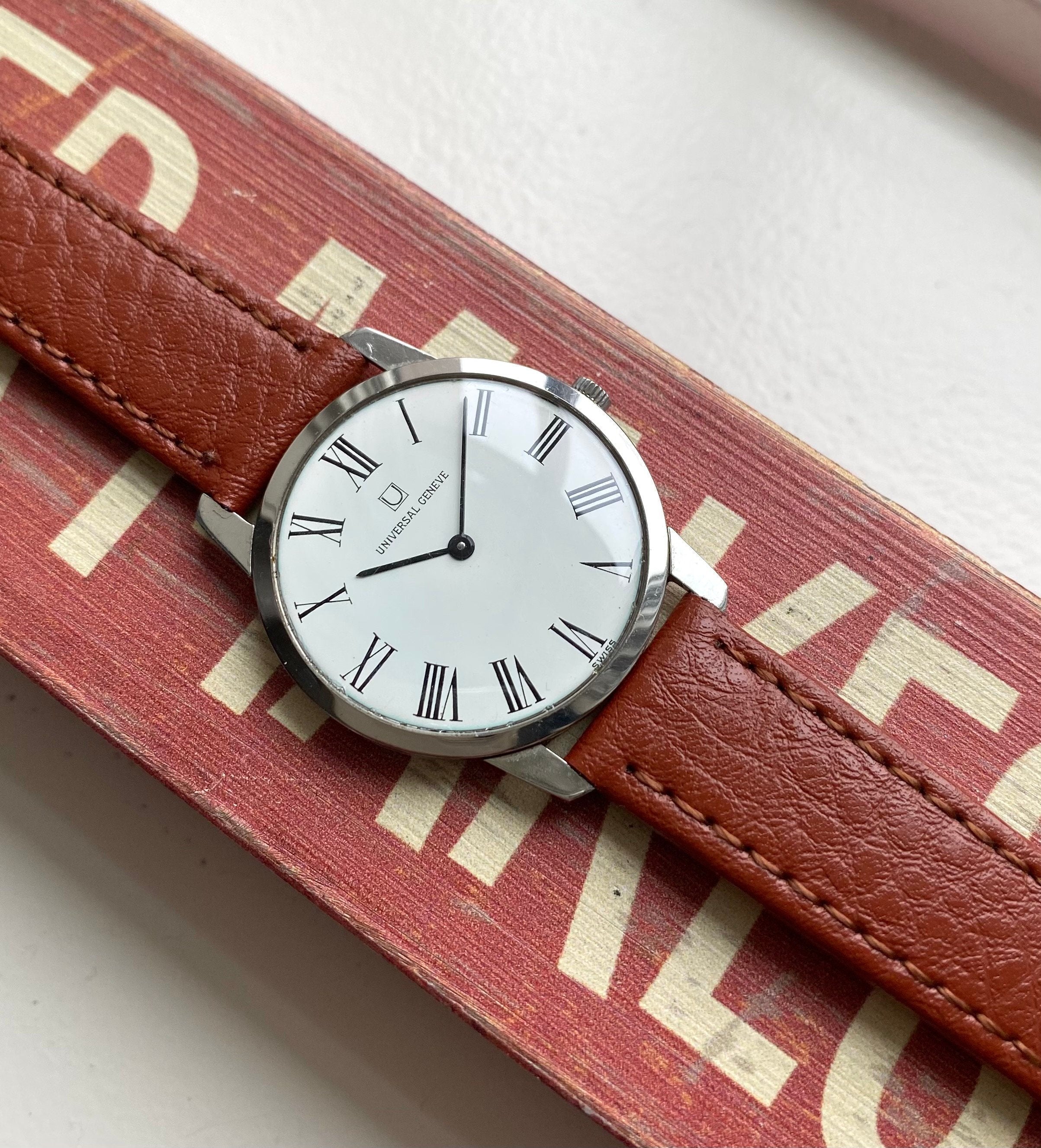 Vintage Universal Geneve Manual Wind White Roman Numeral Dial Steel Case Watch